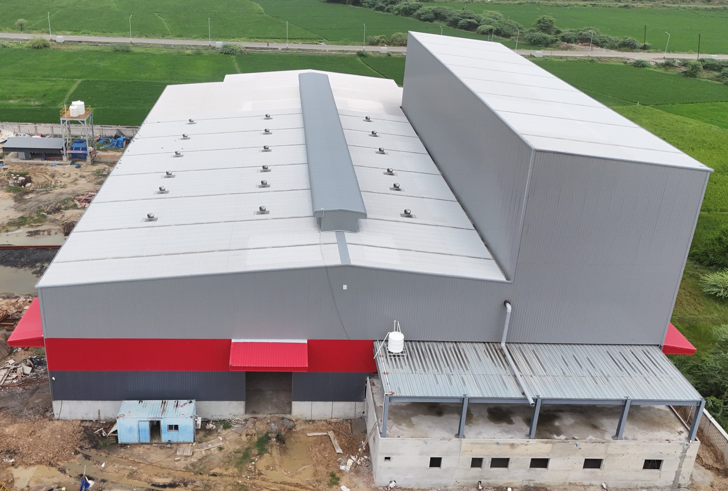 Industrial plant roof with Hi-Rib sheeting, ridge monitor and turbo ventilators by AcuFabInfraStructure