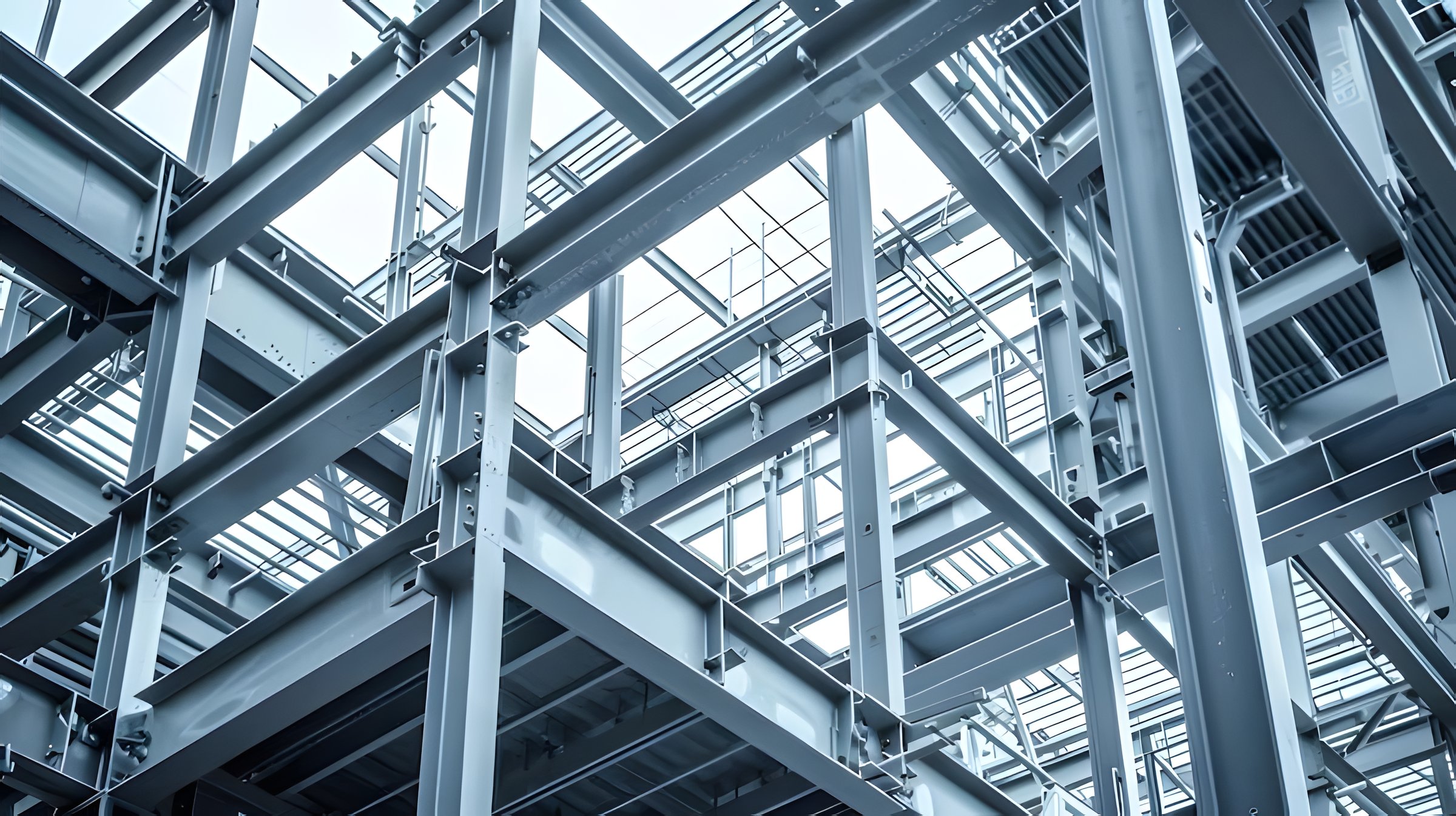 Close-up view of structural steel columns, beams and roof framing